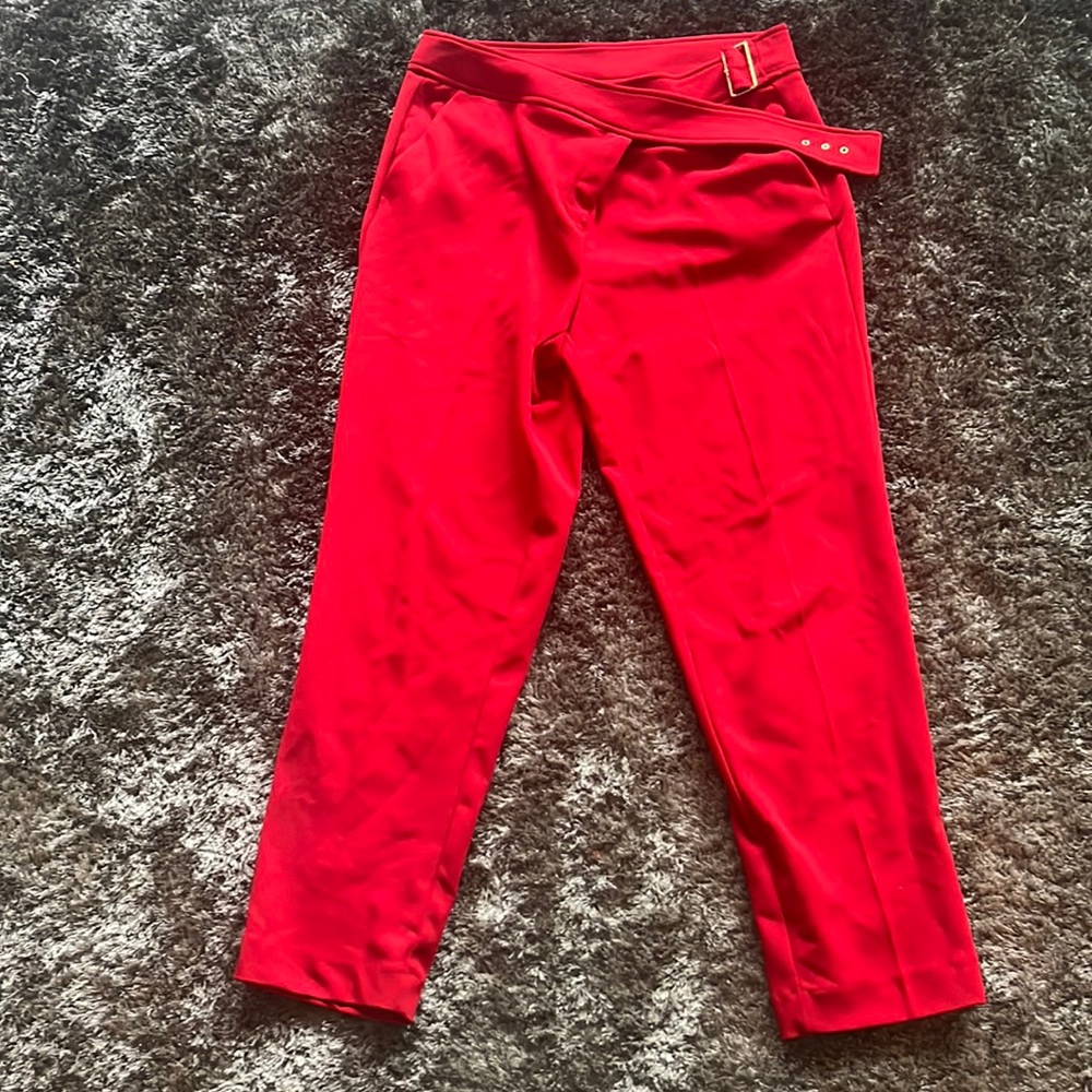 Red cropped pants with gold accents